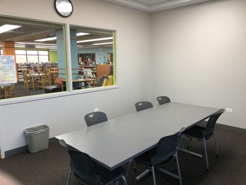 Photo of Study Room 1 in Kids & Teens, with a table and chairs.