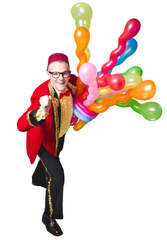 Smarty Pants is holding several long balloons in and the balloons are all in different colors. 