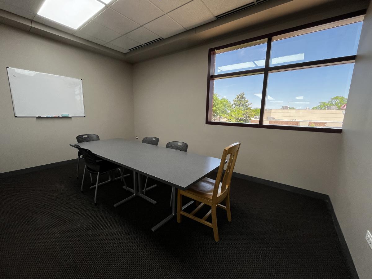 Photo of Study Room 1 in Kids & Teens, with a table and chairs.